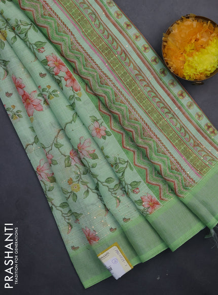 Linen cotton saree light green with allover floral prints & sequin work and silver zari woven border