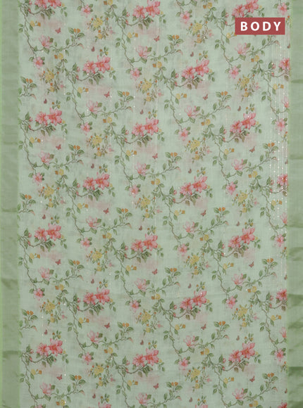 Linen cotton saree light green with allover floral prints & sequin work and silver zari woven border
