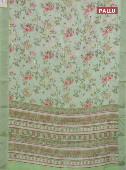 Linen cotton saree light green with allover floral prints & sequin work and silver zari woven border