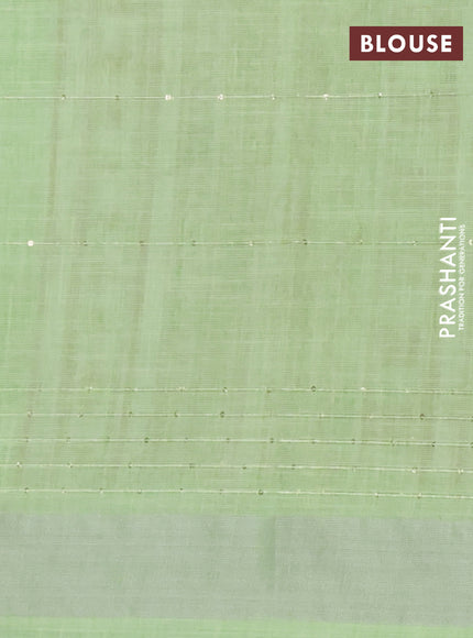 Linen cotton saree light green with allover floral prints & sequin work and silver zari woven border