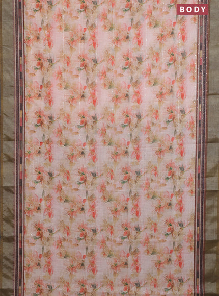 Linen cotton saree pale orange and dark sap green with allover floral prints & sequin work and silver zari woven border