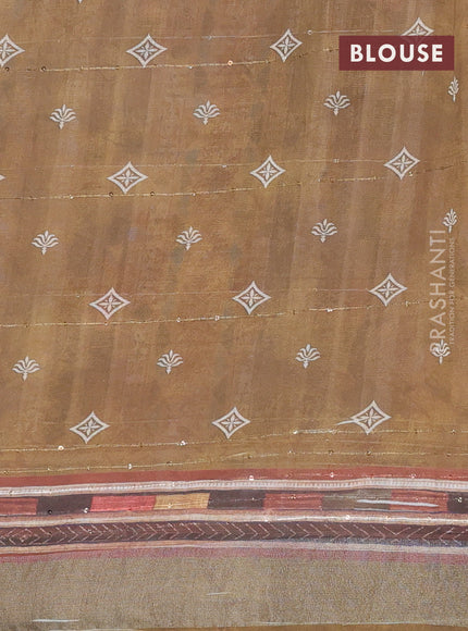 Linen cotton saree pale orange and dark sap green with allover floral prints & sequin work and silver zari woven border