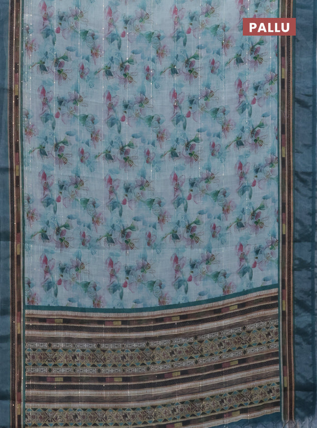 Linen cotton saree teal blue with allover floral prints & sequin work and silver zari woven border