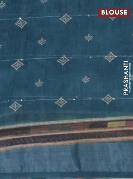 Linen cotton saree teal blue with allover floral prints & sequin work and silver zari woven border