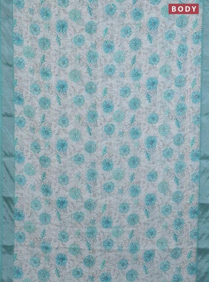 Linen cotton saree cream and teal green with allover floral prints & sequin work and silver zari woven border