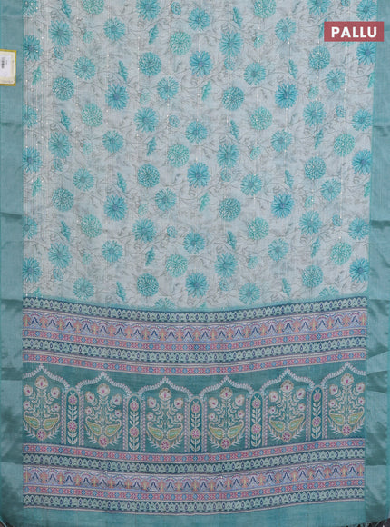 Linen cotton saree cream and teal green with allover floral prints & sequin work and silver zari woven border
