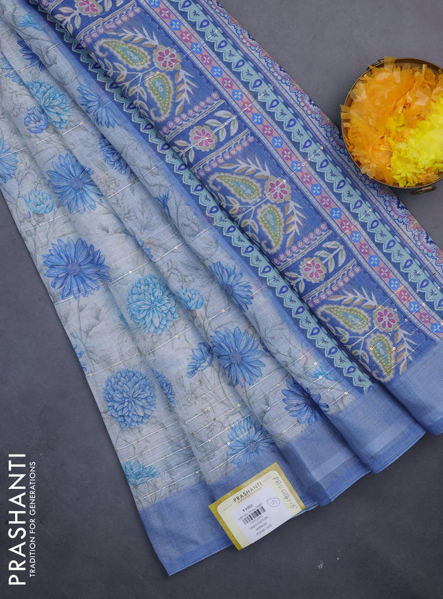 Linen cotton saree cream and blue with allover floral prints & sequin work and silver zari woven border