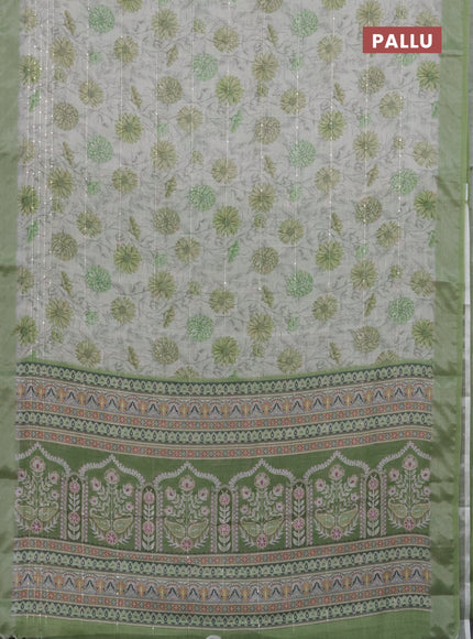 Linen cotton saree cream and green with allover floral prints & sequin work and silver zari woven border