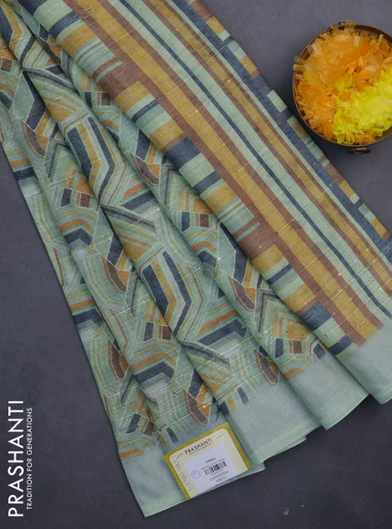 Linen cotton saree pastel green with allover geometric prints & sequin work and silver zari woven border