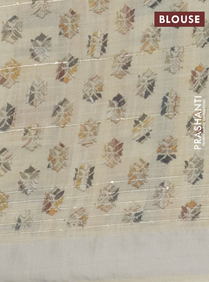 Linen cotton saree pale yellow with allover geometric prints & sequin work and silver zari woven border