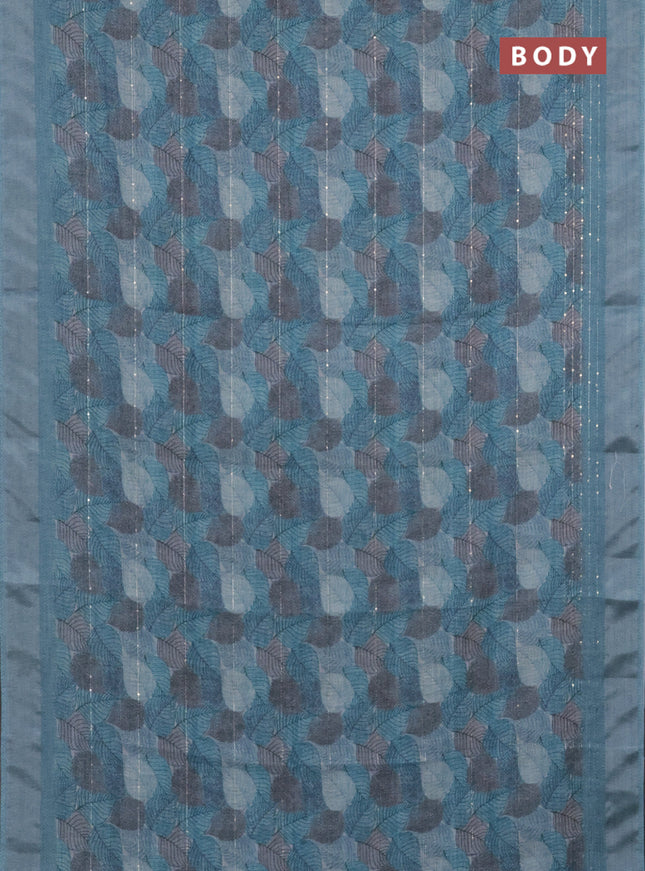 Linen cotton saree teal blue with allover leaf prints & sequin work and silver zari woven border