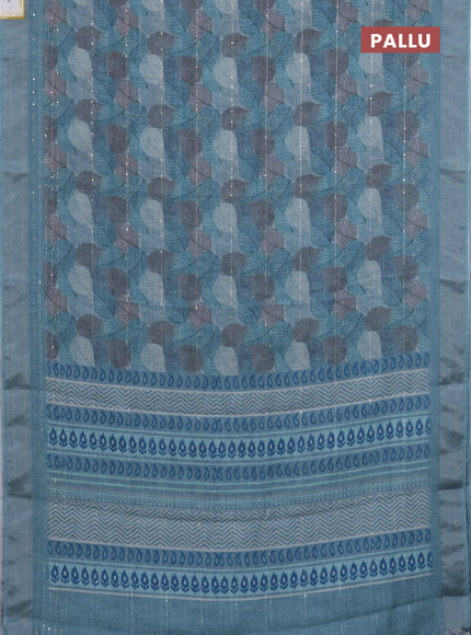 Linen cotton saree teal blue with allover leaf prints & sequin work and silver zari woven border