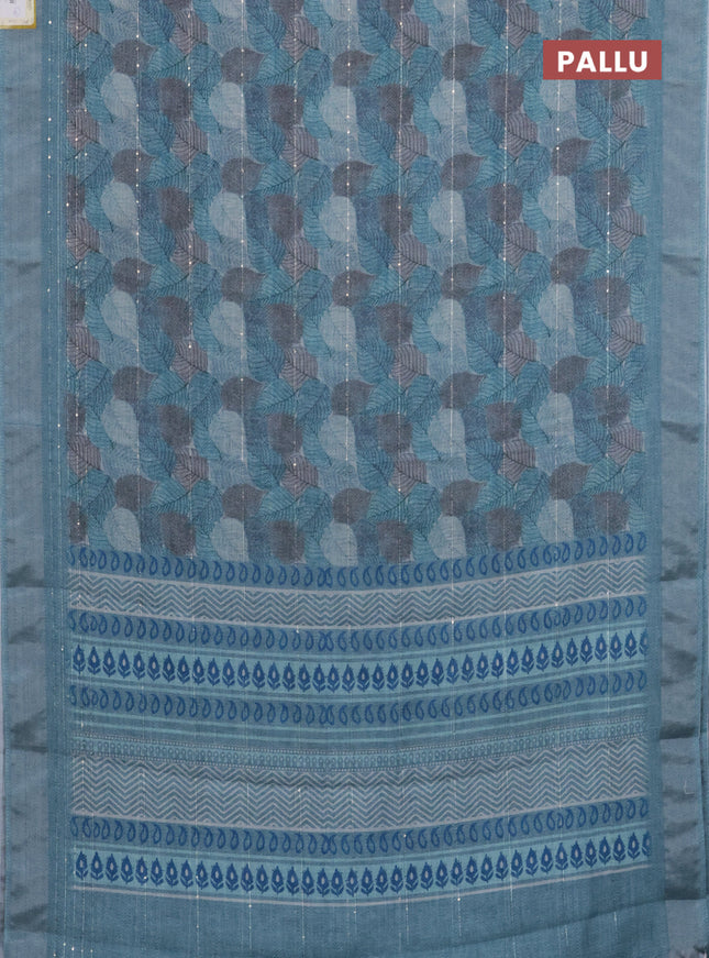 Linen cotton saree teal blue with allover leaf prints & sequin work and silver zari woven border