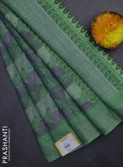 Linen cotton saree light green with allover leaf prints & sequin work and silver zari woven border