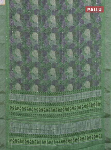 Linen cotton saree light green with allover leaf prints & sequin work and silver zari woven border