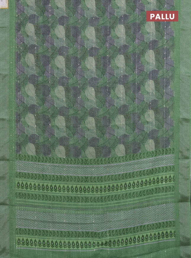 Linen cotton saree light green with allover leaf prints & sequin work and silver zari woven border