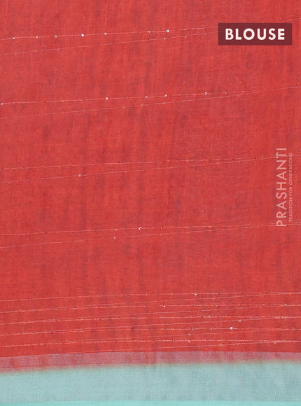 Linen cotton saree teal green with allover prints & sequin work and silver zari woven border