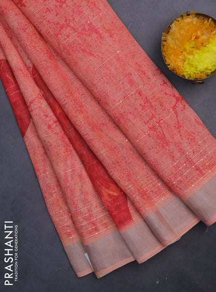 Linen cotton saree pale orange with allover prints & sequin work and silver zari woven border
