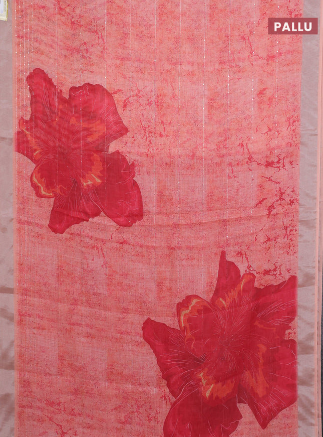 Linen cotton saree pale orange with allover prints & sequin work and silver zari woven border