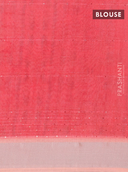 Linen cotton saree pale orange with allover prints & sequin work and silver zari woven border