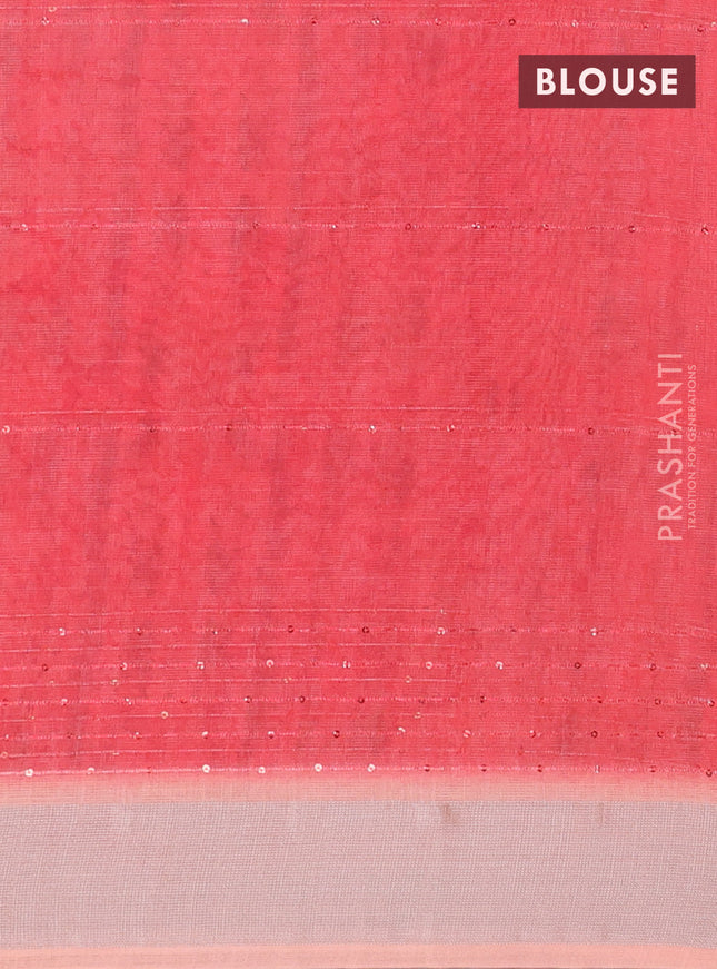 Linen cotton saree pale orange with allover prints & sequin work and silver zari woven border