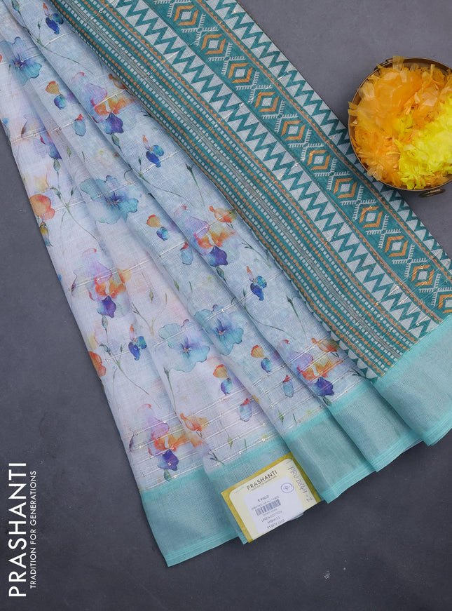 Linen cotton saree off white and teal green with allover floral prints & sequin work and silver zari woven border