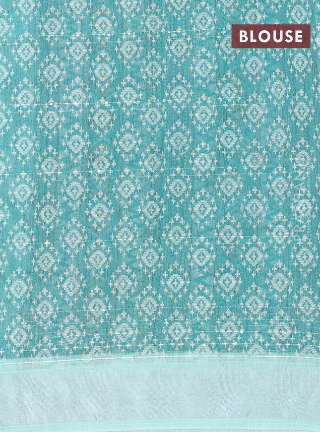 Linen cotton saree off white and teal green with allover floral prints & sequin work and silver zari woven border