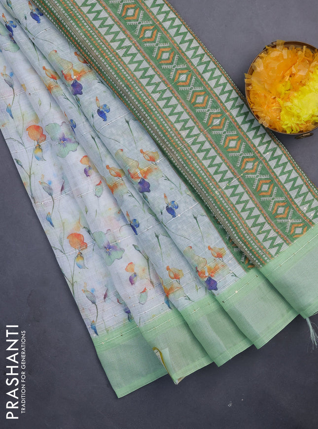 Linen cotton saree off white and light green with allover floral prints & sequin work and silver zari woven border