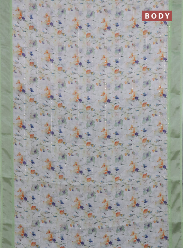 Linen cotton saree off white and light green with allover floral prints & sequin work and silver zari woven border