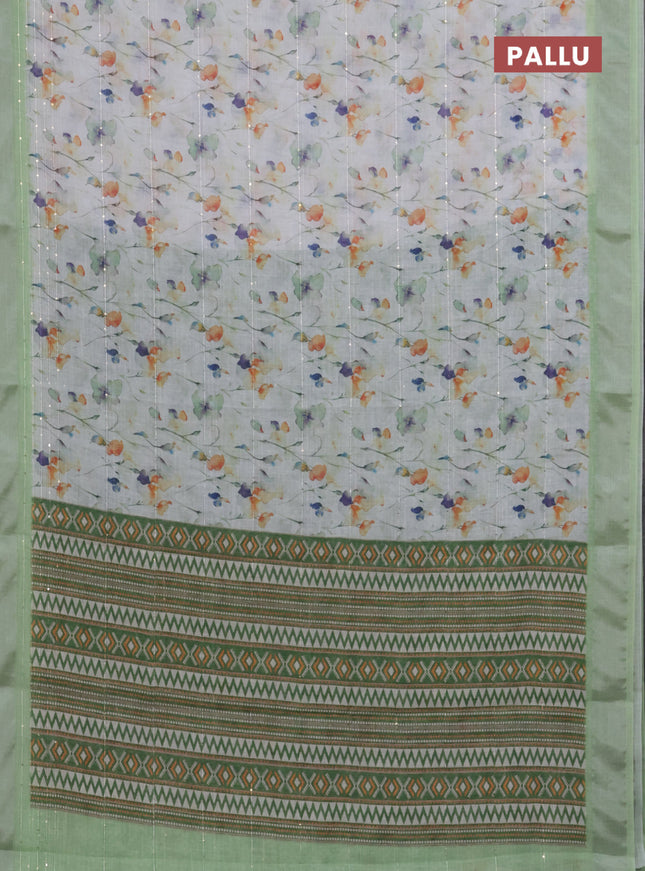 Linen cotton saree off white and light green with allover floral prints & sequin work and silver zari woven border