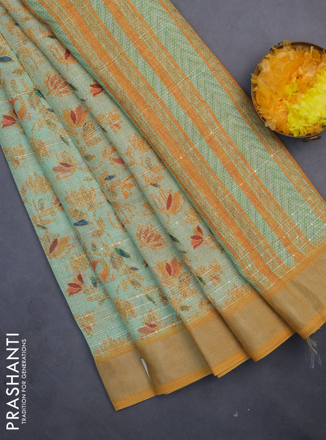 Linen cotton saree light green and mustard shade with allover prints & sequin work and silver zari woven border