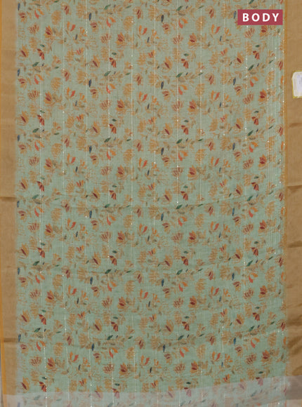 Linen cotton saree light green and mustard shade with allover prints & sequin work and silver zari woven border