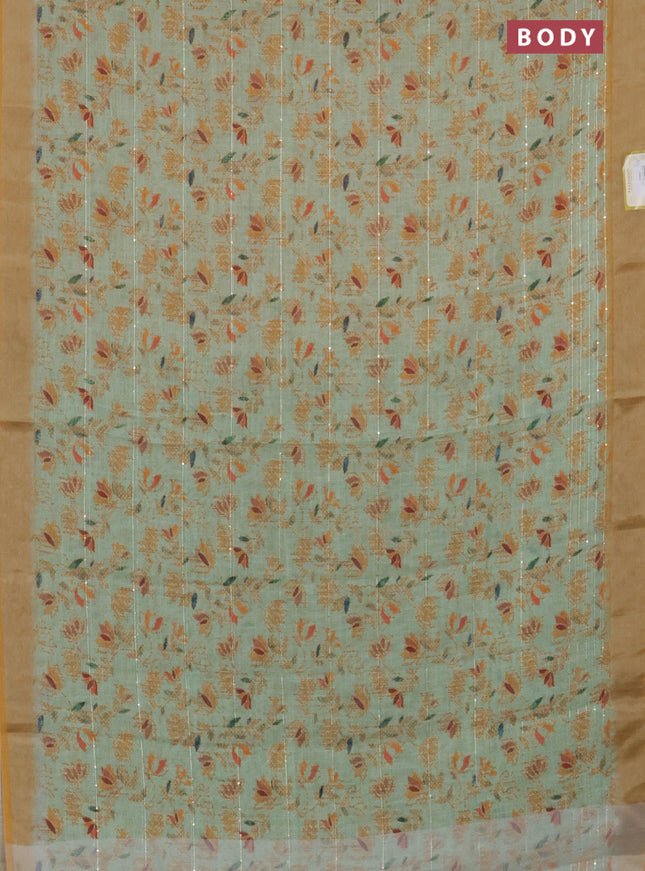 Linen cotton saree light green and mustard shade with allover prints & sequin work and silver zari woven border