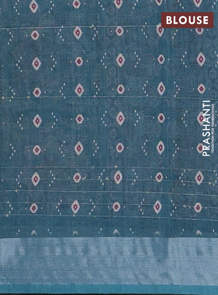 Linen cotton saree teal blue with floral prints & sequin work and silver zari woven border
