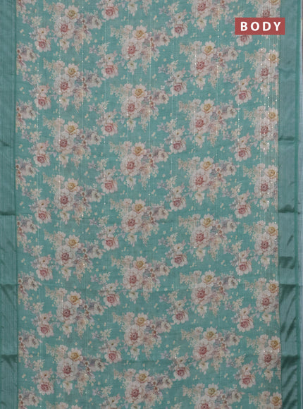 Linen cotton saree teal green with floral prints & sequin work and silver zari woven border