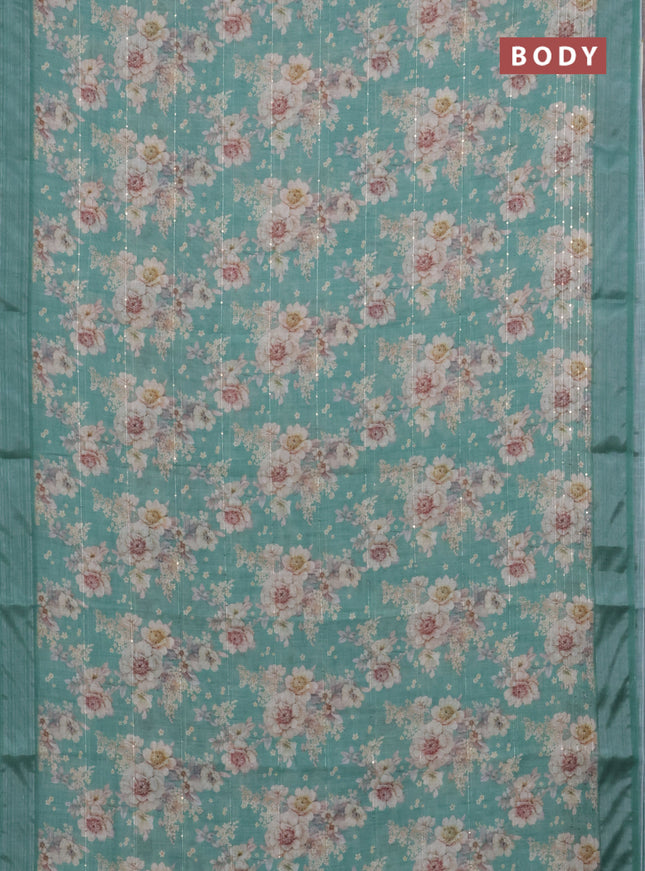 Linen cotton saree teal green with floral prints & sequin work and silver zari woven border