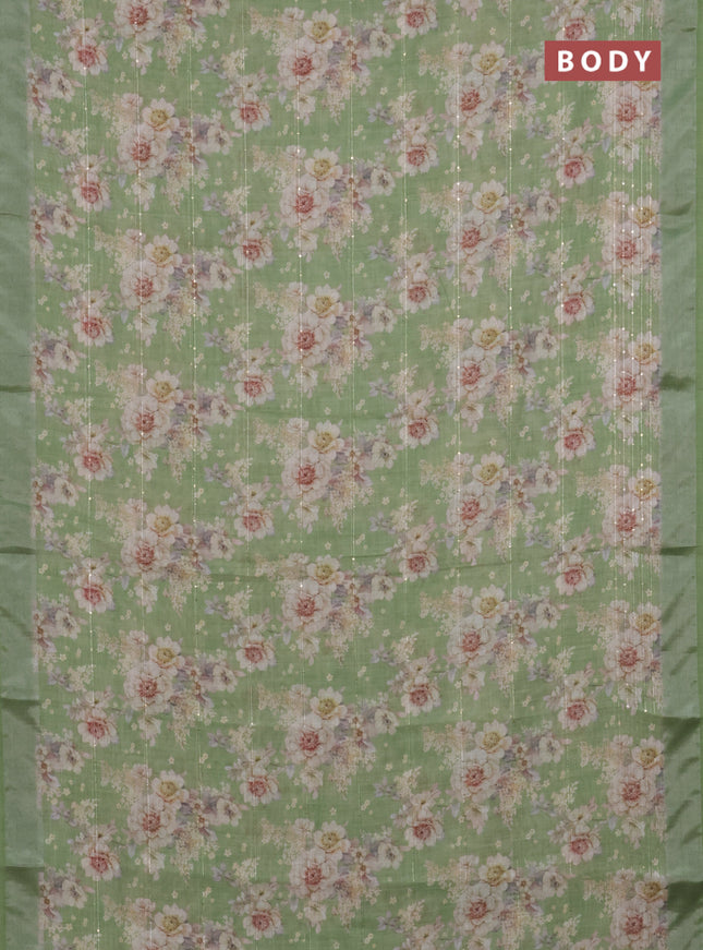 Linen cotton saree green with floral prints & sequin work and silver zari woven border
