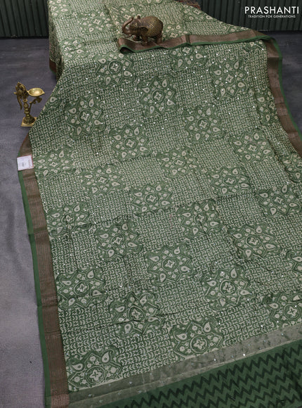 Chanderi silk cotton saree pastel green with allover prints & mirror work and woven border