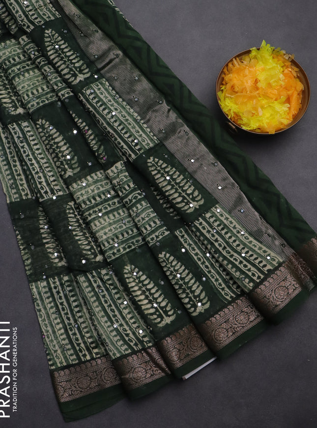 Chanderi silk cotton saree green with allover prints & mirror work and woven border