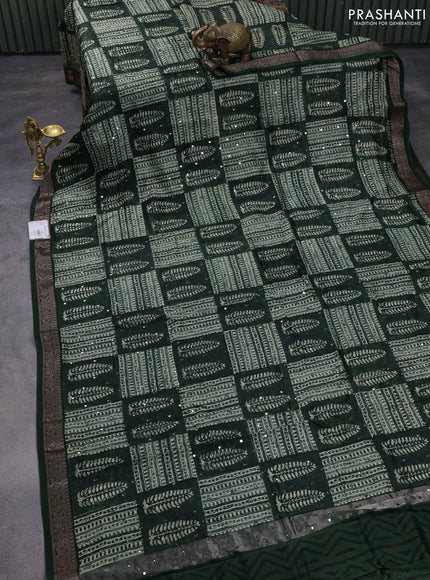 Chanderi silk cotton saree green with allover prints & mirror work and woven border