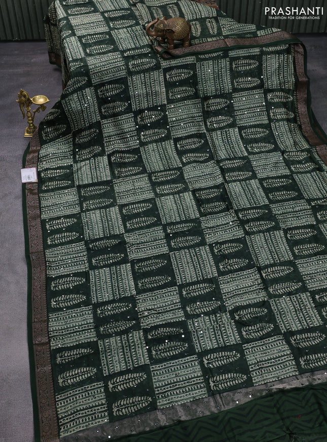 Chanderi silk cotton saree green with allover prints & mirror work and woven border