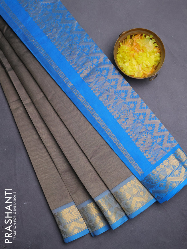 Silk cotton saree grey and cs blue with plain body and zari woven border