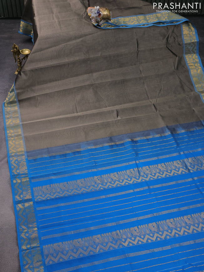 Silk cotton saree grey and cs blue with plain body and zari woven border