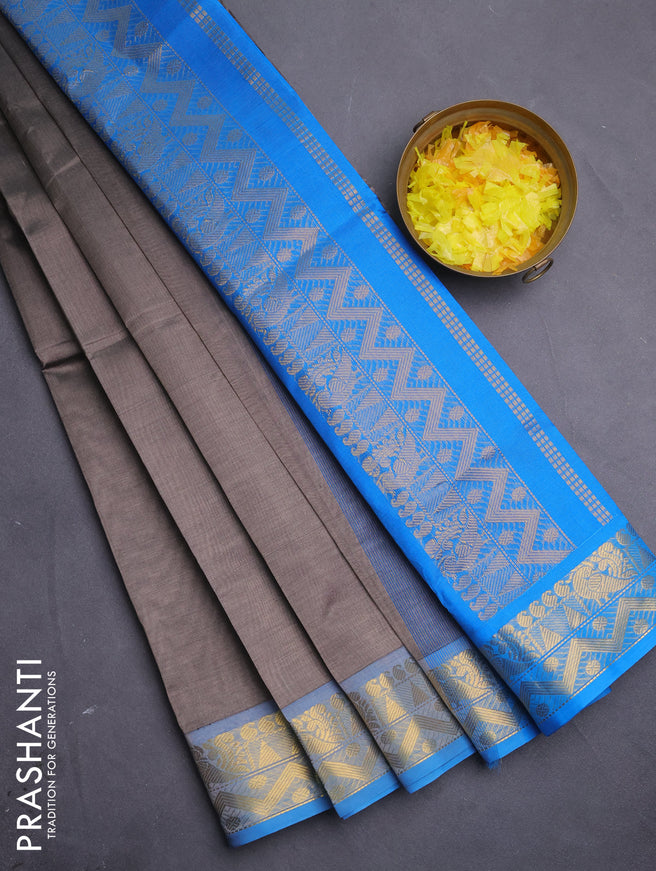 Silk cotton saree grey and cs blue with plain body and zari woven border