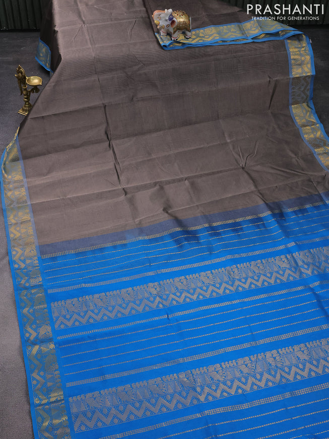 Silk cotton saree grey and cs blue with plain body and zari woven border