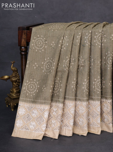 Semi tussar saree elaichi green and beige with allover bandhani prints and embroidery cut work border