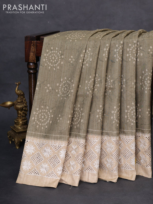 Semi tussar saree elaichi green and beige with allover bandhani prints and embroidery cut work border