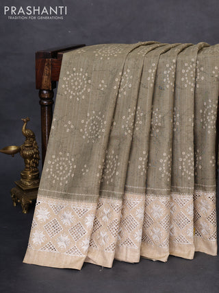 Semi tussar saree elaichi green and beige with allover bandhani prints and embroidery cut work border