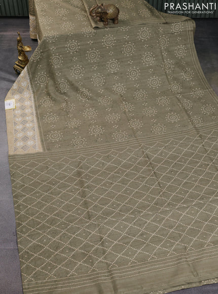 Semi tussar saree elaichi green and beige with allover bandhani prints and embroidery cut work border
