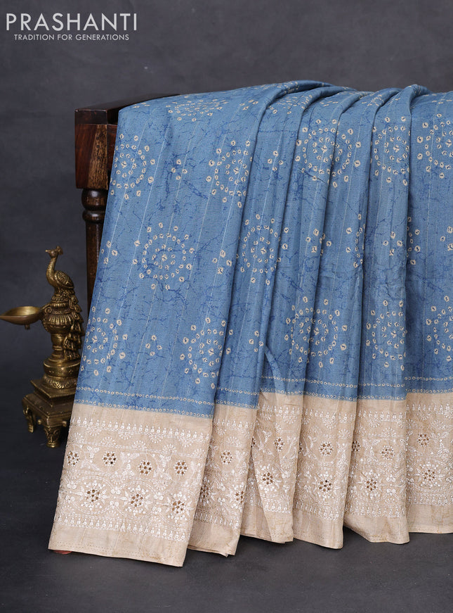 Semi tussar saree pastel blue and beige with allover bandhani prints and embroidery cut work border